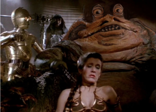 A badly photoshopped picture of jabba the hut with eye stalks and floppy ears.